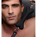 Master Series Hound Adjustable Dog Bone Gag: black bone-shaped gag on a black leather strap with red stitching.