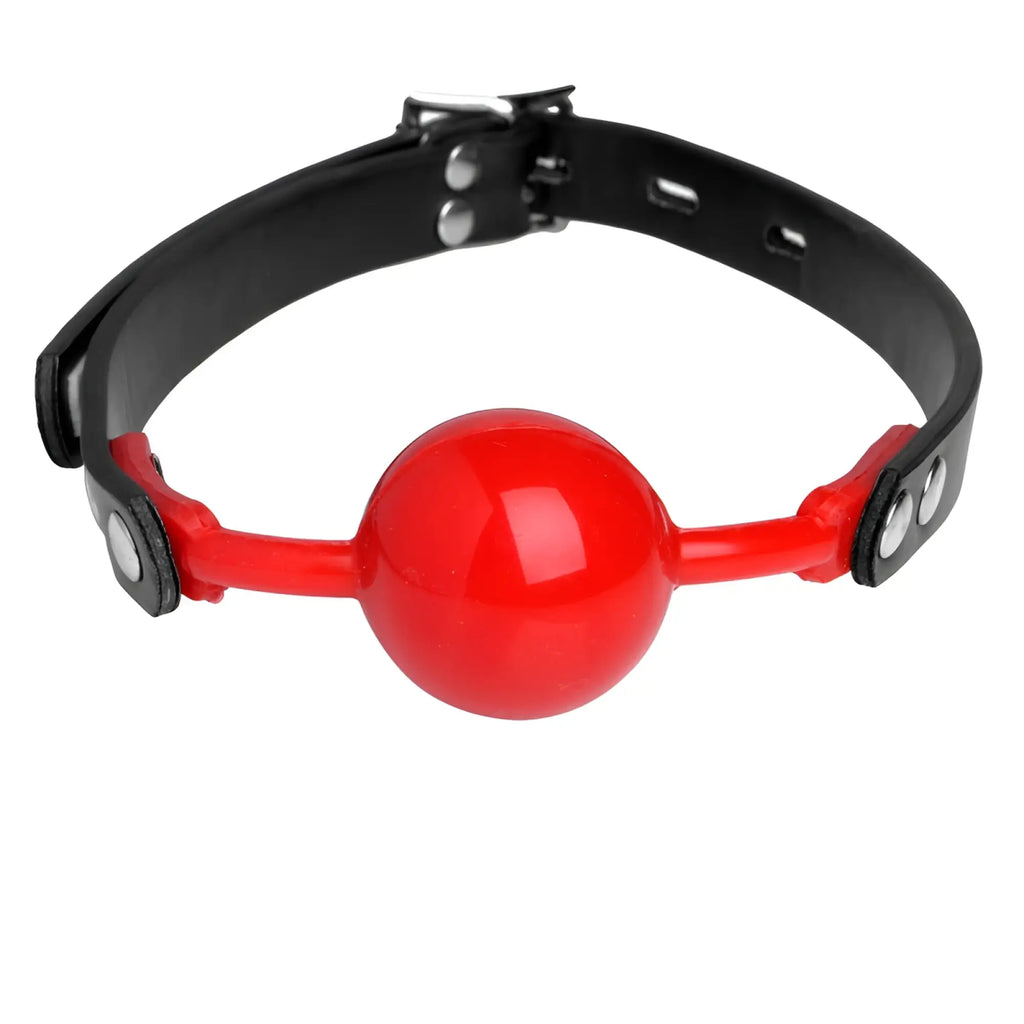 Master Series Hush Comfort silicone ball gag featuring a glossy red sphere on a black adjustable buckled collar.