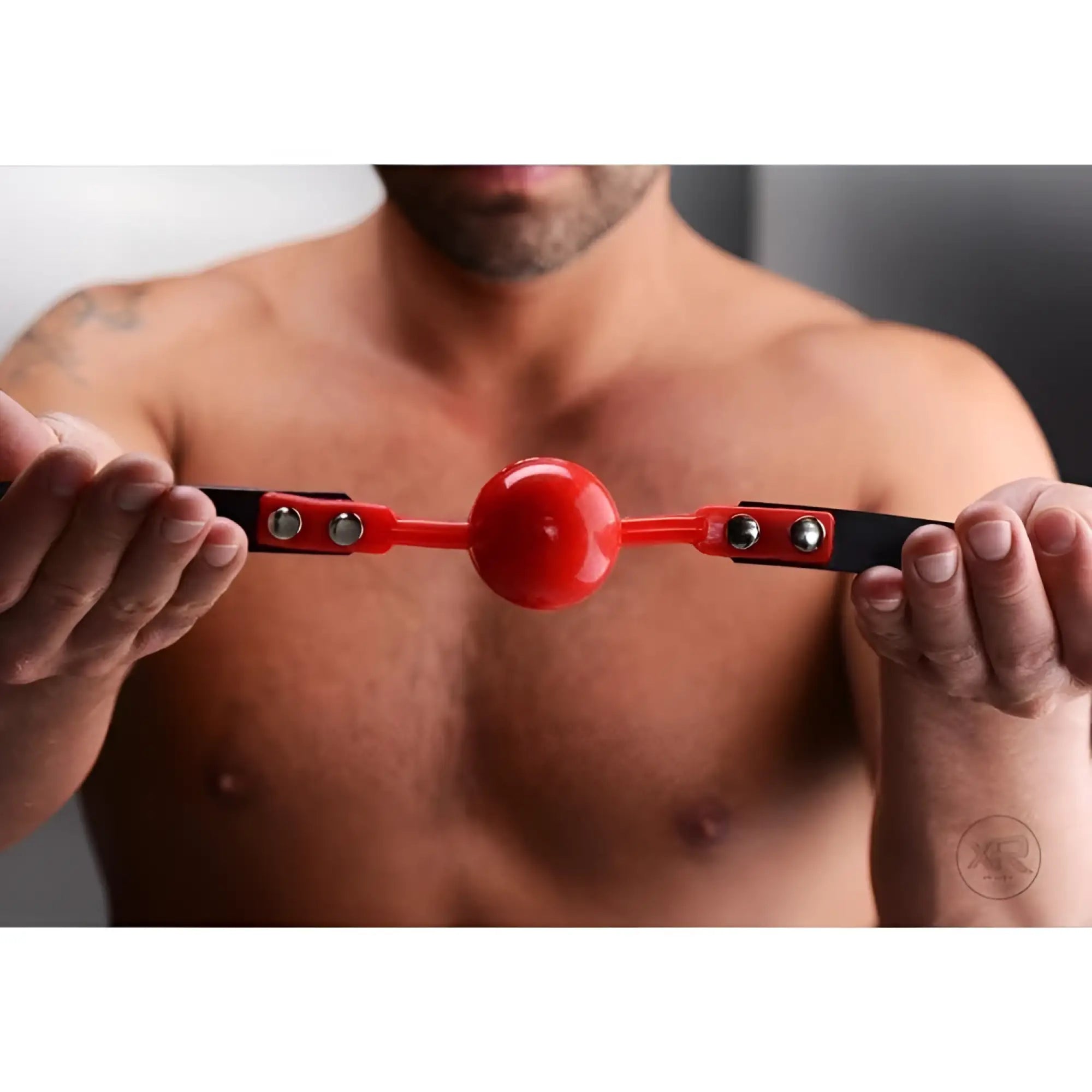 Master Series Hush Comfort ball gag featuring a red silicone ball, red connectors, and black adjustable straps.