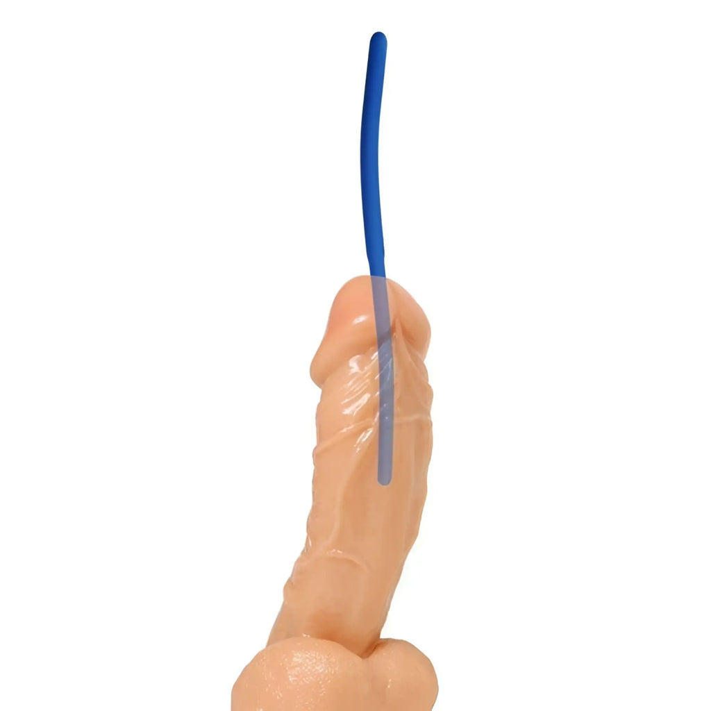 Master Series Invasion Silicone Urethral Sound: a thin, blue flexible rod inserted into a realistic skin-tone model.