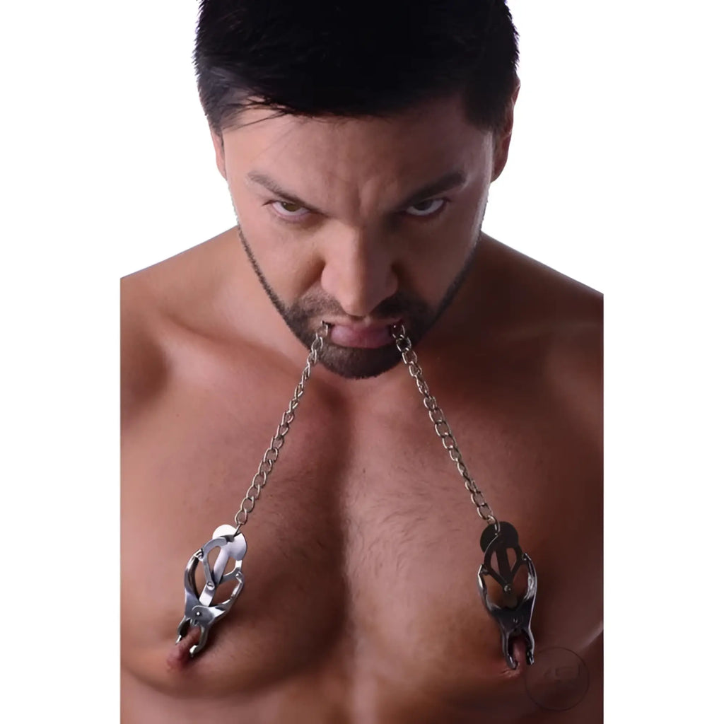 Master Series Japanese Clover Clamps: silver metal nipple clamps connected by chains to a man's mouth.