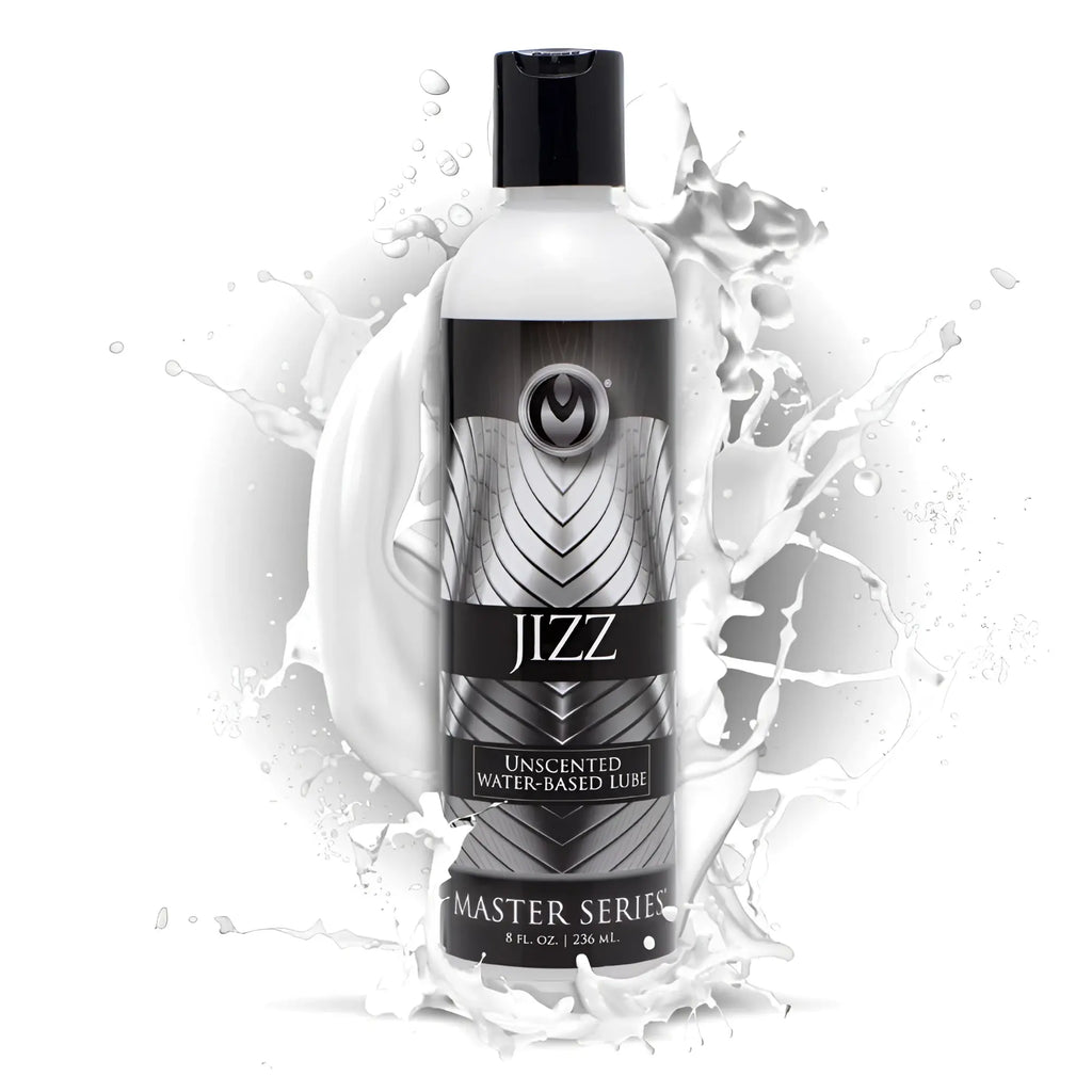 Master Series Jizz Unscented Water-Based Lube bottle in black and silver, centered against a white liquid splash.