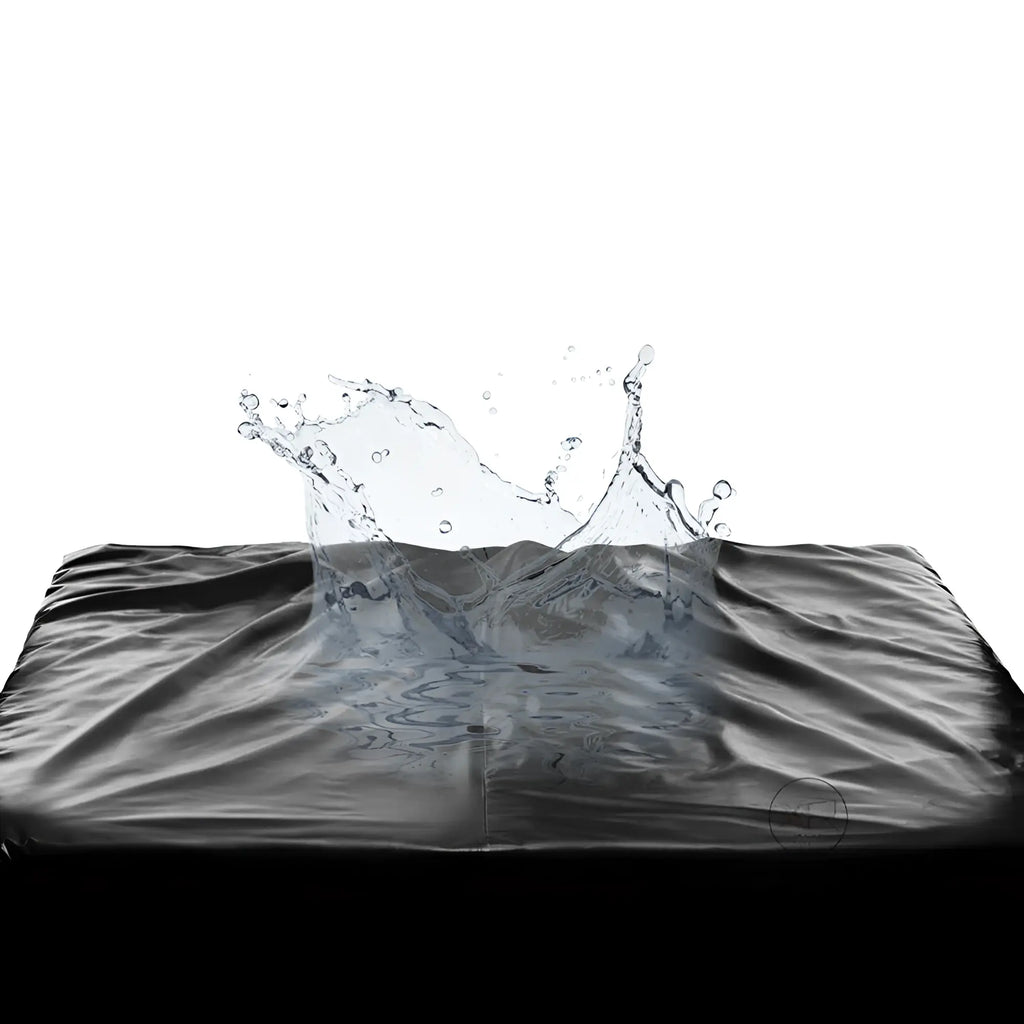 Master Series King Size black waterproof fitted sheet with a dramatic water splash effect on the surface.