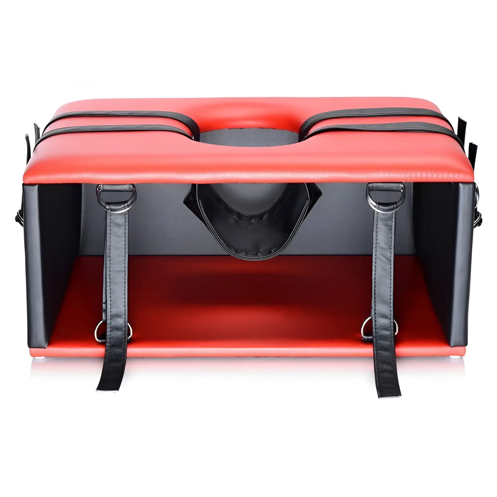 Master Series The Kinging Chair: Red and black padded block chair with central cutout, black straps, and metal D-rings.