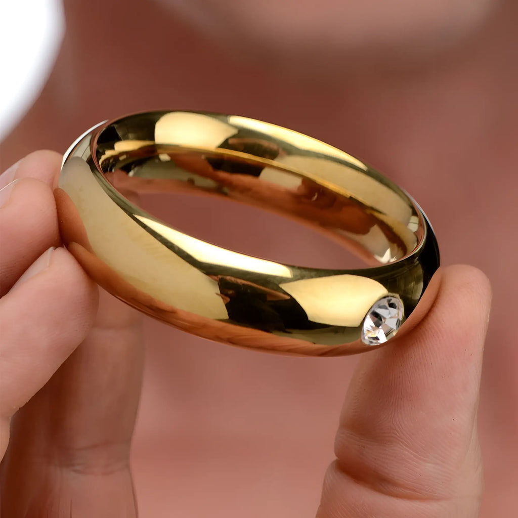 Master Series Kings Diamond Crown cock ring: a smooth, gold-tone metal ring featuring a single inset clear crystal.