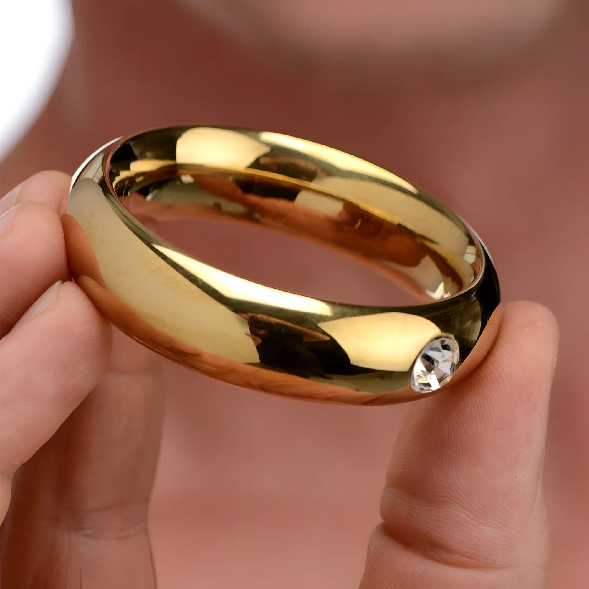 Master Series Kings Diamond Crown cock ring: a smooth, gold-tone metal ring featuring a single inset clear crystal.