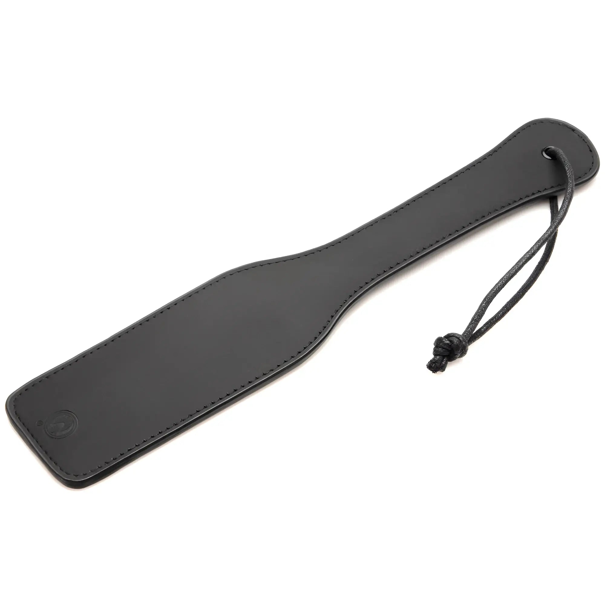 Master Series paddle from the Master of Kink set, a black faux leather sensory paddle with a matching wrist strap.