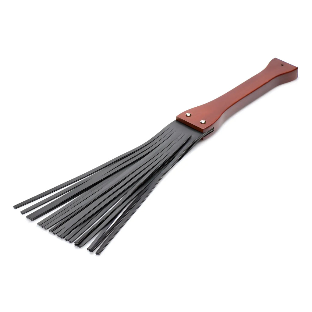 Master Series Master Lasher wooden flogger featuring a smooth mahogany handle and long, flexible black rubber tails.