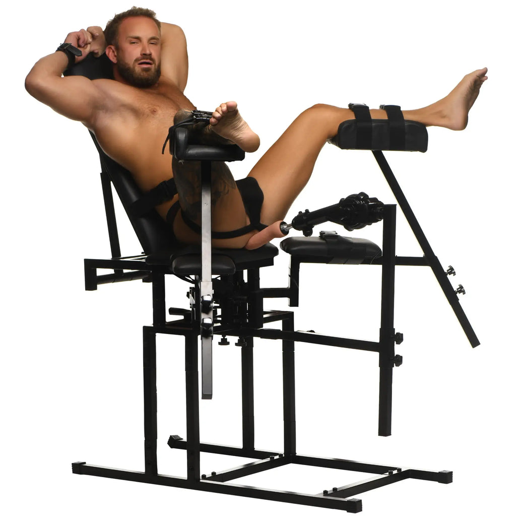 Master Series Leg Spreader Obedience Chair with black metal frame, cushioned leg supports, and attached sex machine.