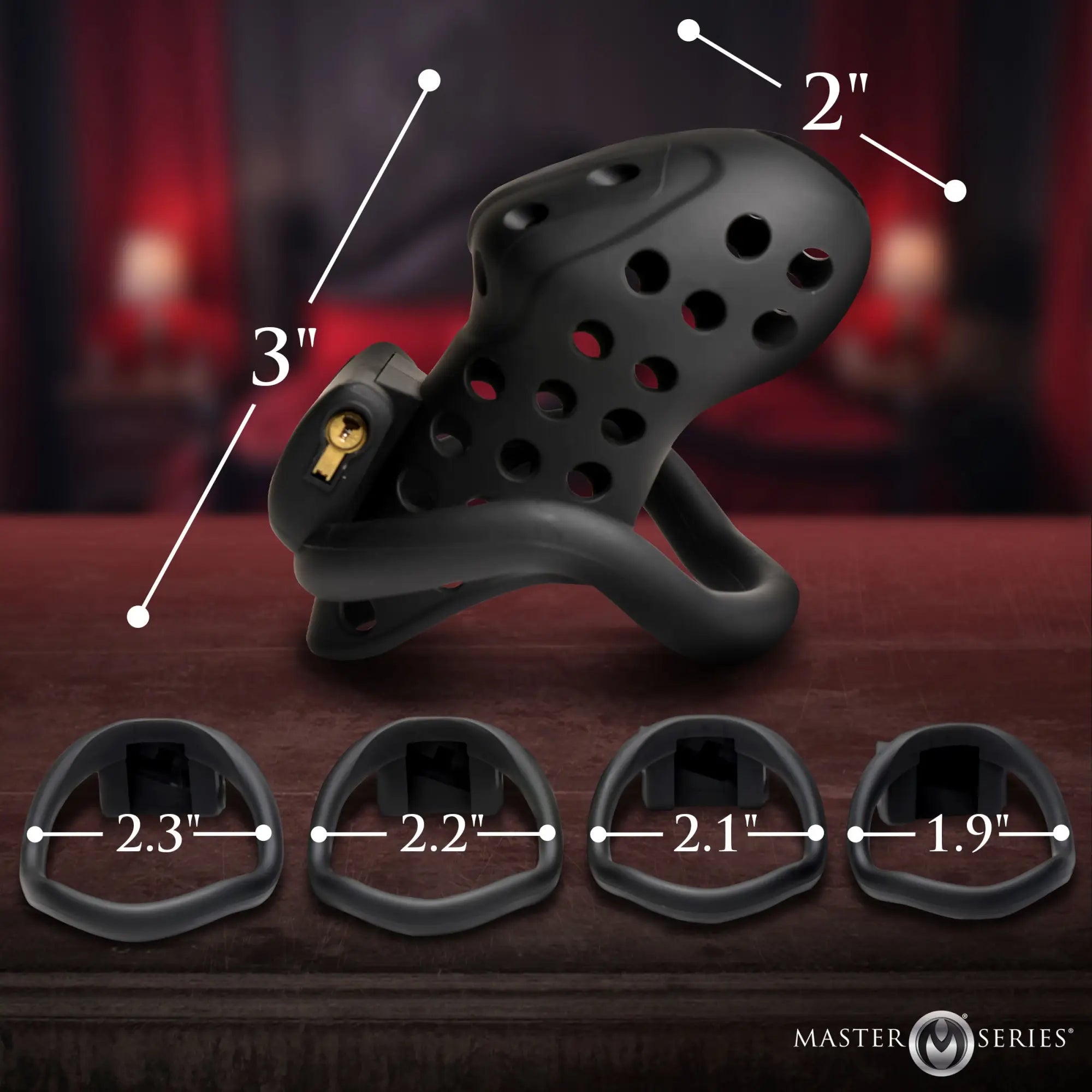 Master Series The Lock Down: A matte black, ventilated silicone chastity cage with four different sized base rings.