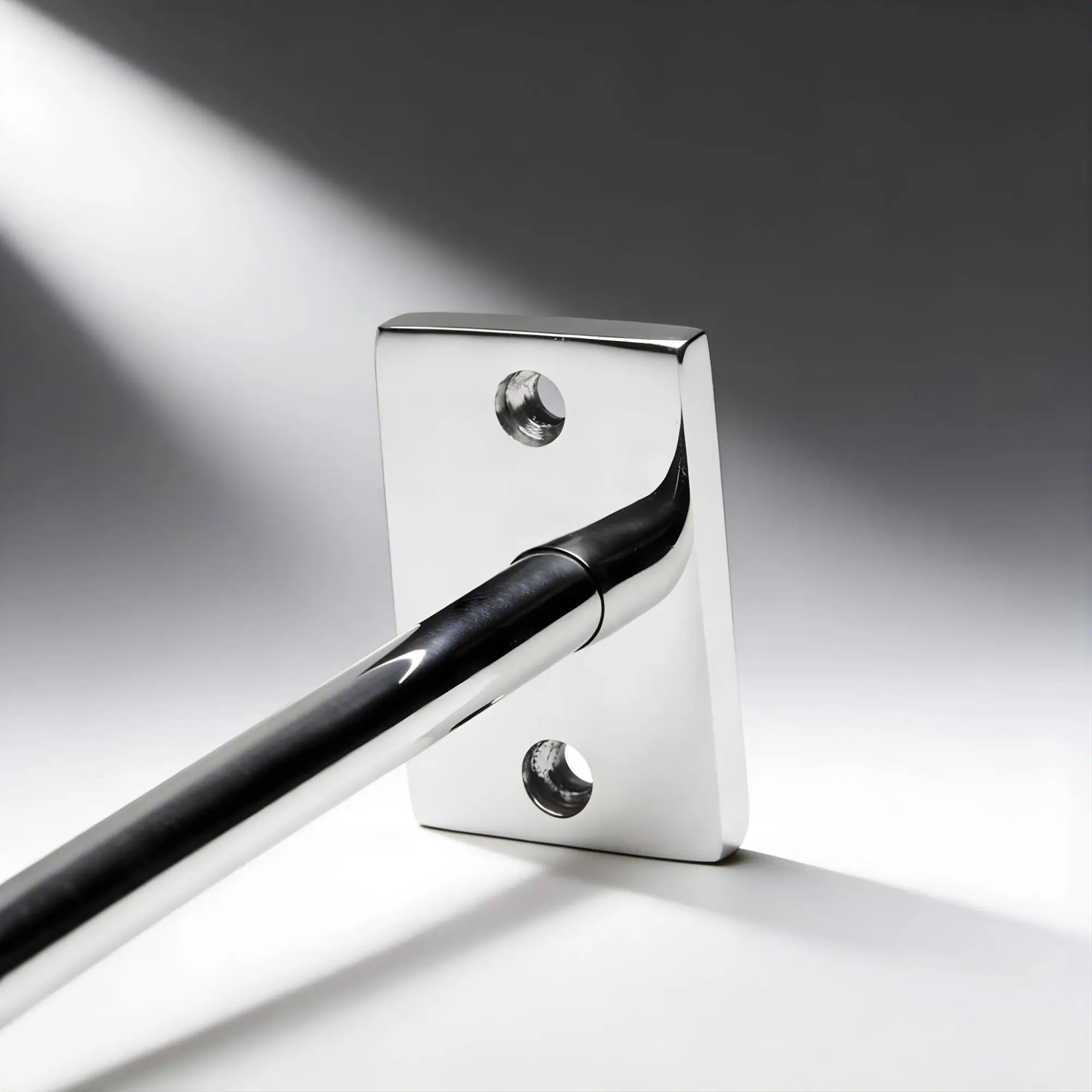 Master Series Locking Mounted Scrotum Cuff: A polished chrome metal mounting plate with a sleek, horizontal bar.