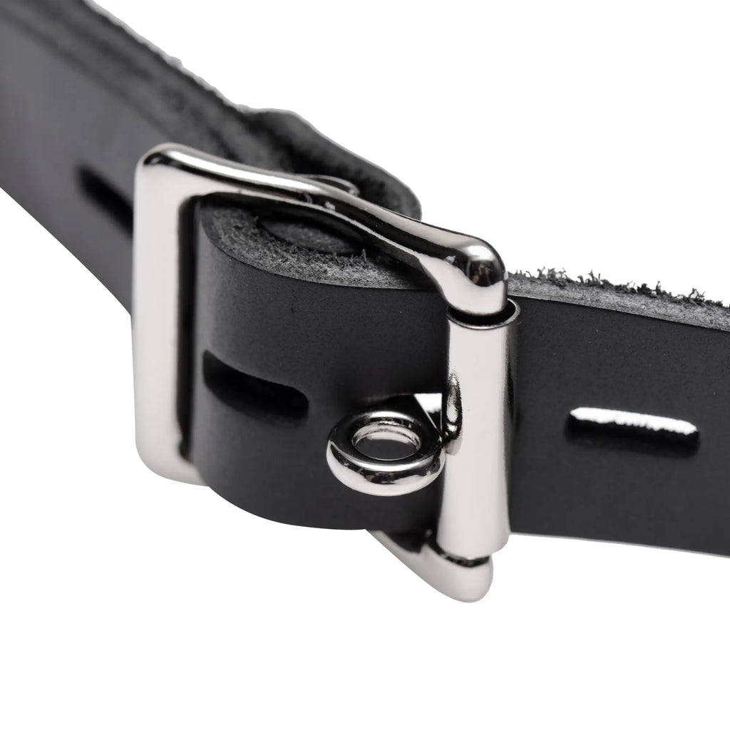 Master Series Locking Open Mouth Gag: Close-up of a black leather strap with a polished silver buckle and locking ring.