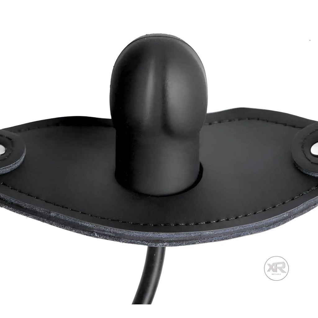 Master Series Locking Penis Pump Gag: A matte black silicone phallic-shaped plug centered on a black leather-style strap.