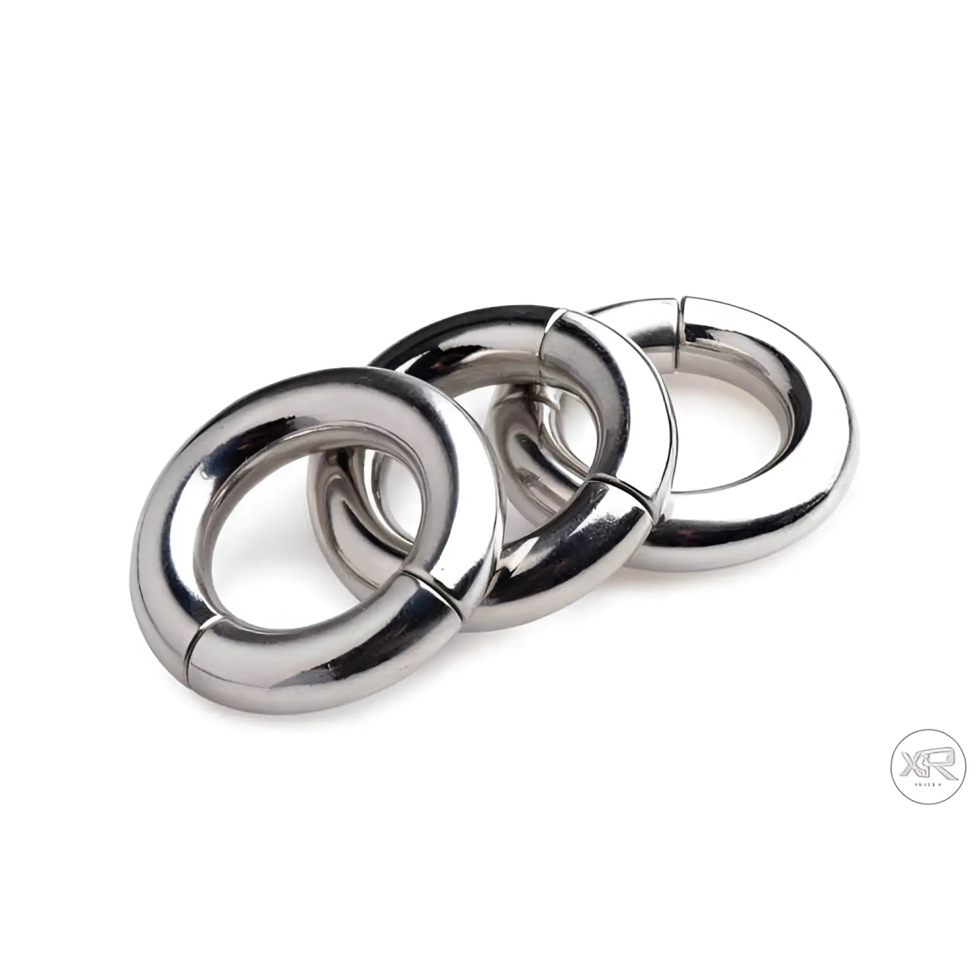 Three polished silver Master Series Magnetize stainless steel magnetic ball stretchers stacked against a white background.