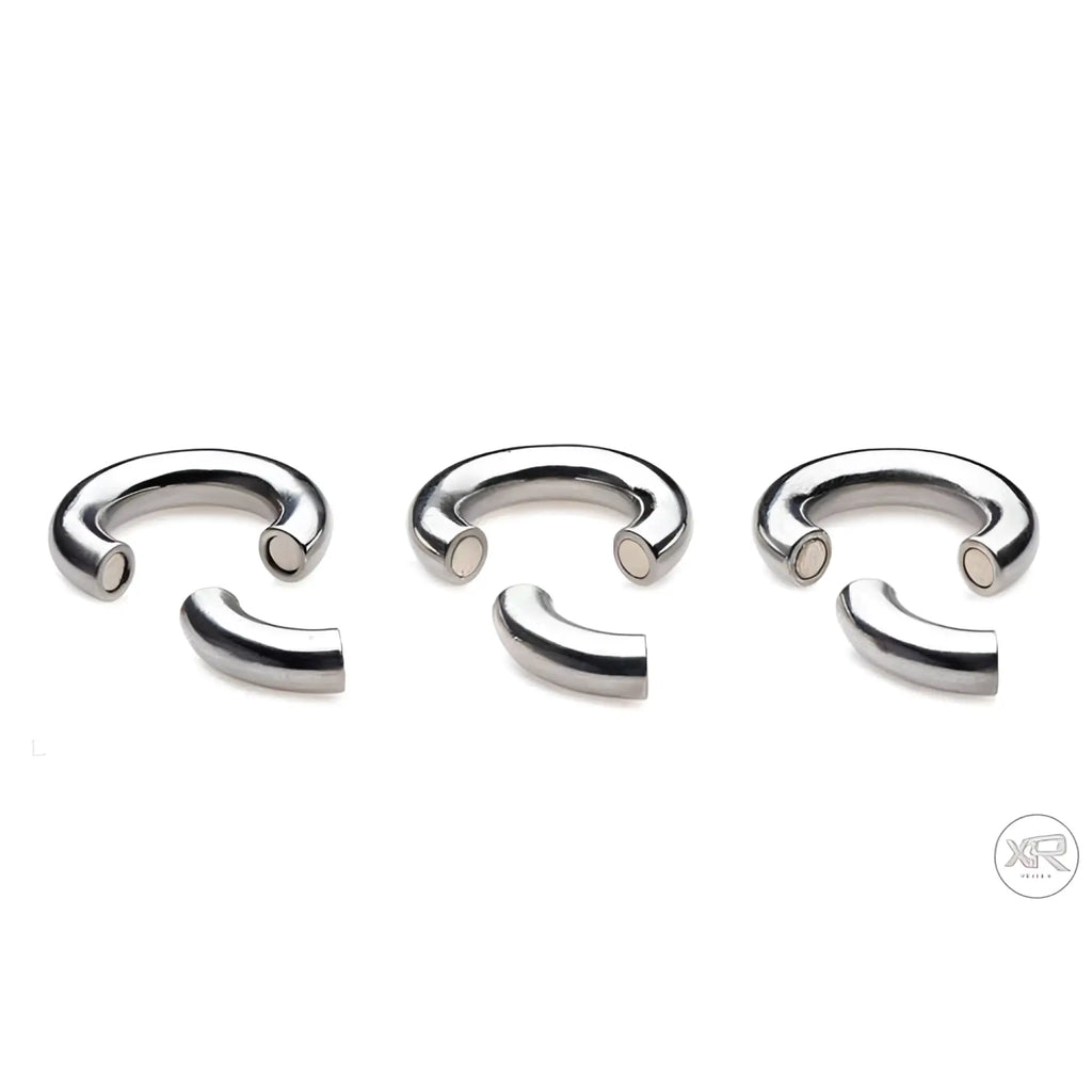 Master Series Magnetize: Three silver-tone stainless steel magnetic ball stretcher rings with open ends.