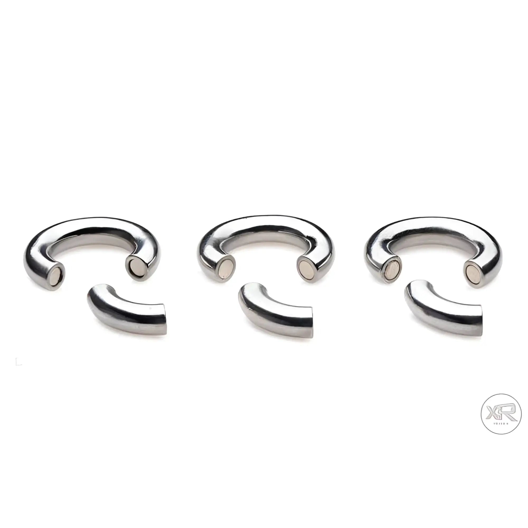 Master Series Magnetize: Three silver-tone stainless steel magnetic ball stretcher rings with open ends.