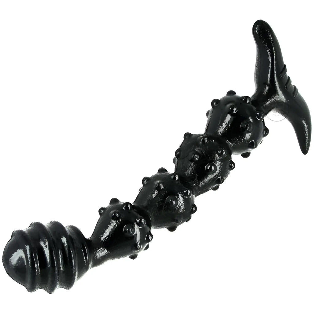 Black Master Series Manticore anal plug with a ribbed, studded shaft and a T-shaped base on a white background.
