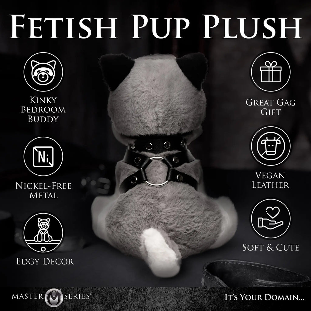 Master Series Max the Fetish Pup plush toy, seen from behind, wearing a black vegan leather harness with metal rings.