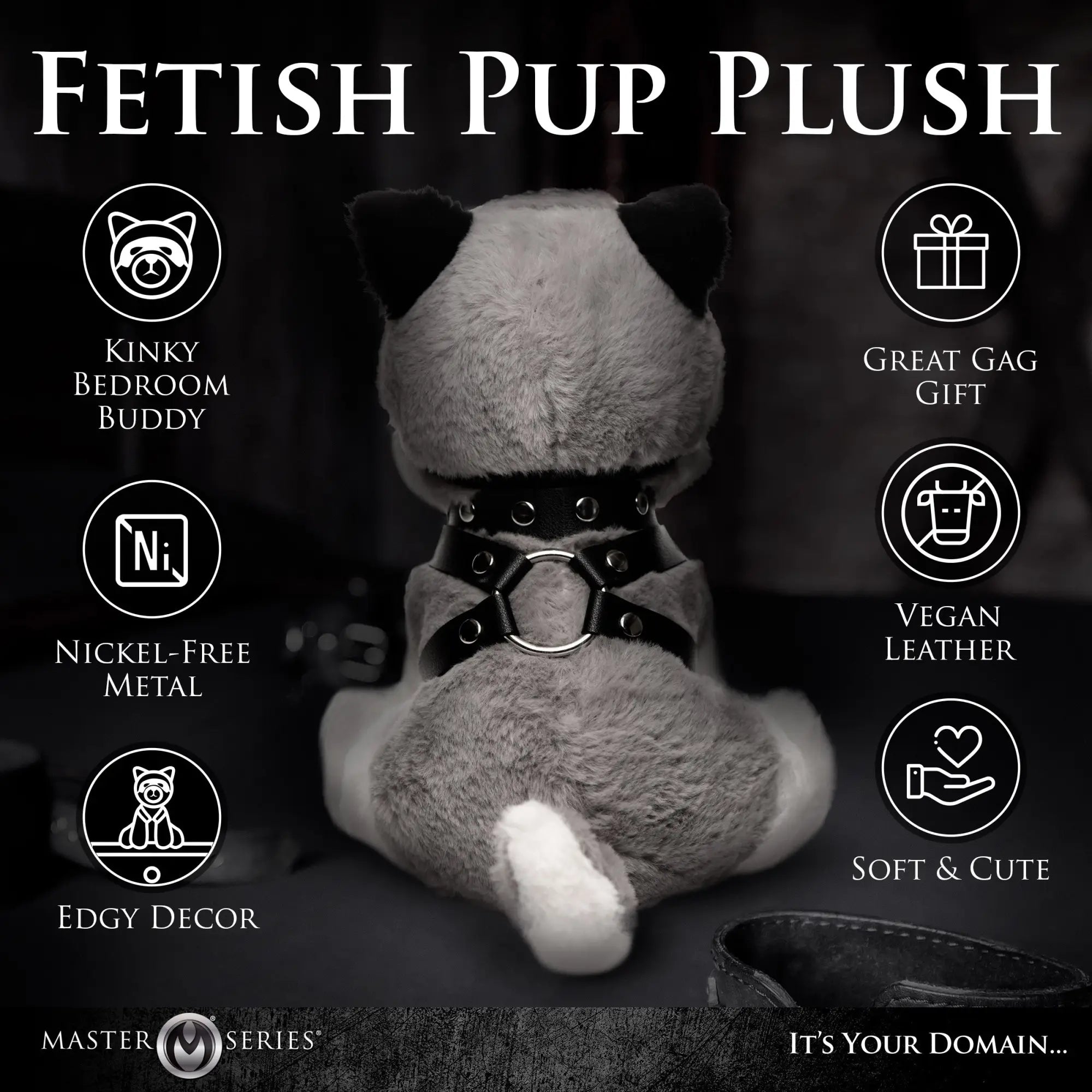 Master Series Max the Fetish Pup plush toy, seen from behind, wearing a black vegan leather harness with metal rings.