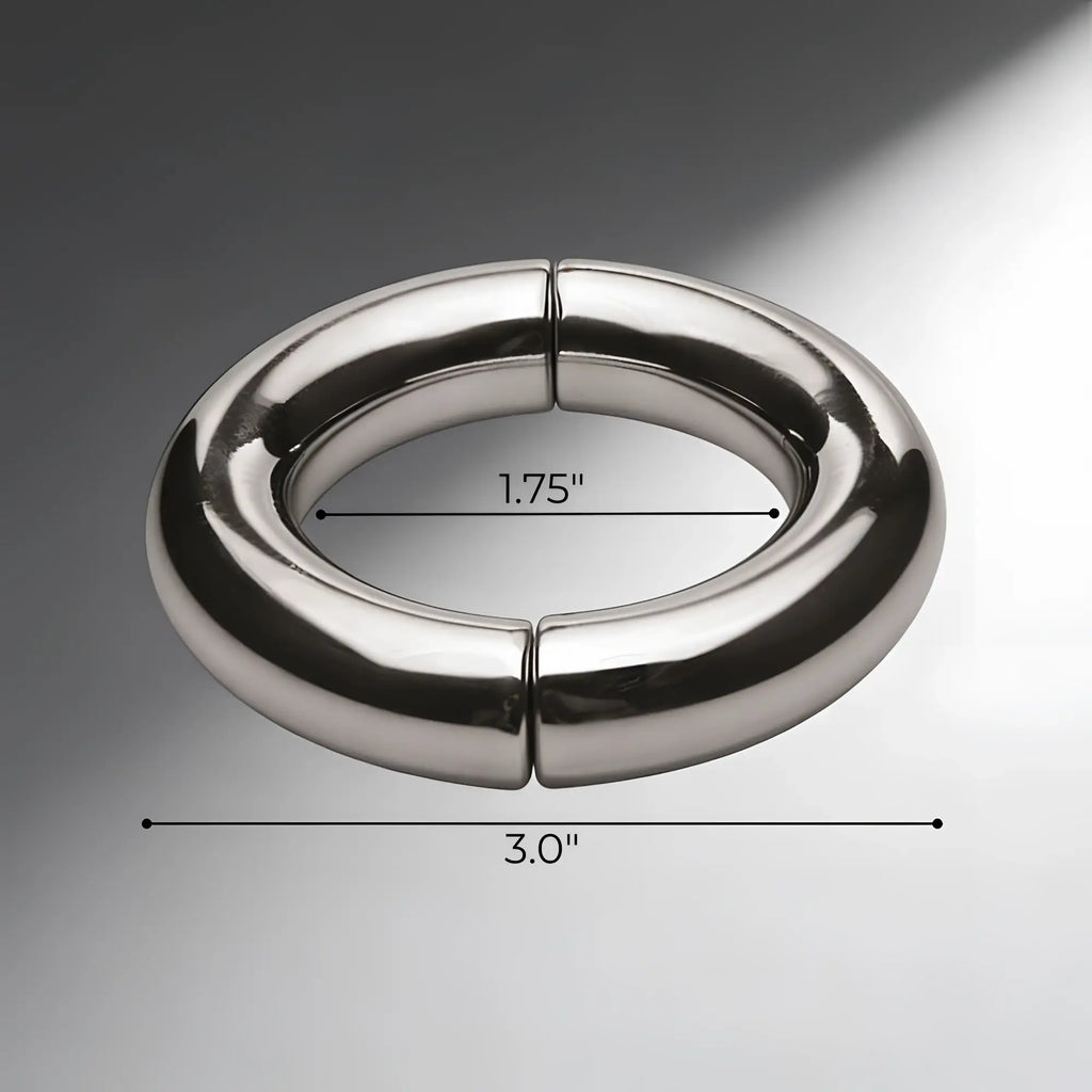 Master Series Mega Magnetize stainless steel cock ring. Polished silver, two-piece magnetic design, 1.75" by 3" scale.