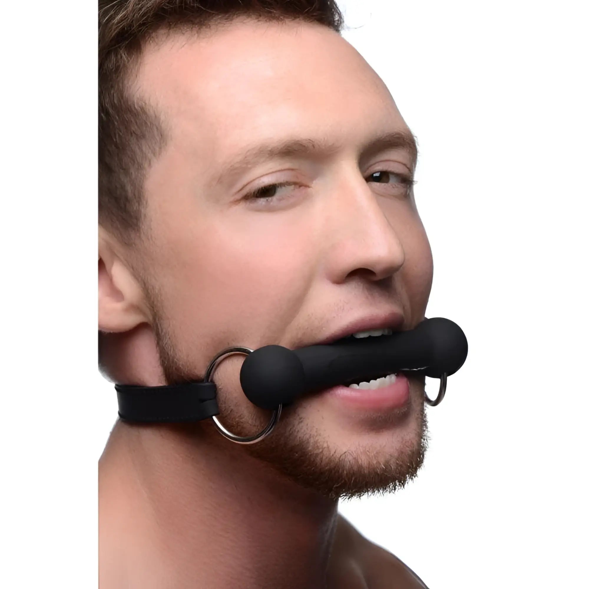 Master Series Mr Ed lockable black silicone bit gag worn by a man, featuring a black bar and a black strap.