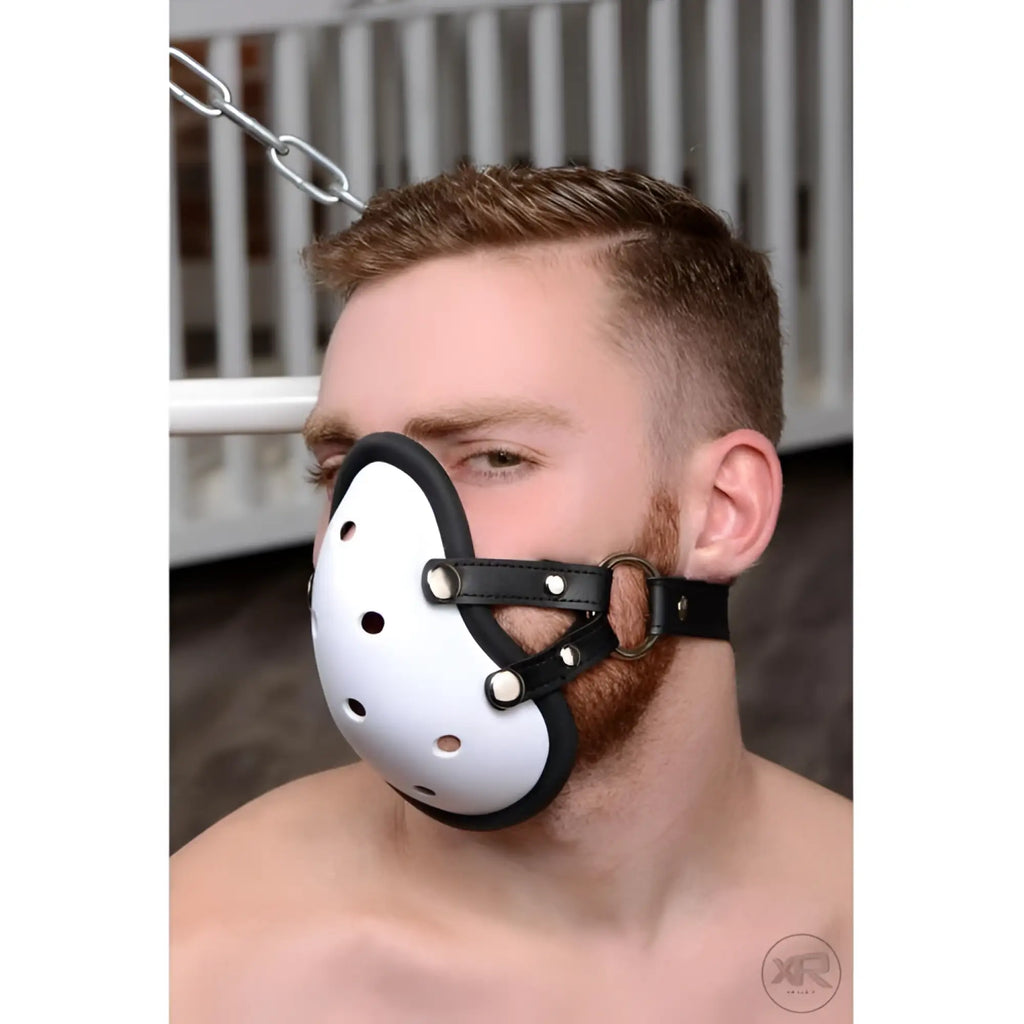 Master Series Musk Athletic Cup Muzzle: A white, perforated, cup-style mask with black leather straps and silver rings.