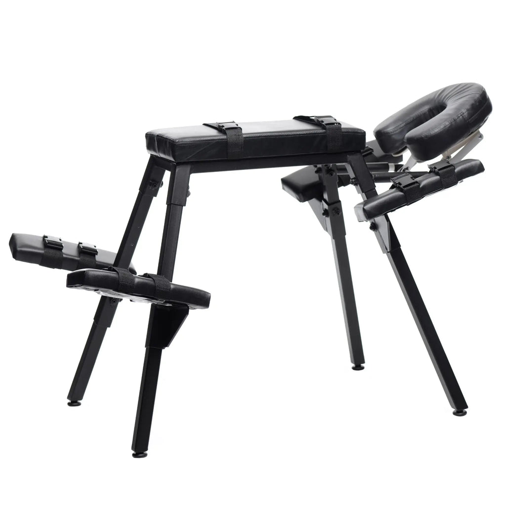 Master Series Obedience Extreme Sex Bench: black metal frame with padded leather surfaces and adjustable restraint straps.