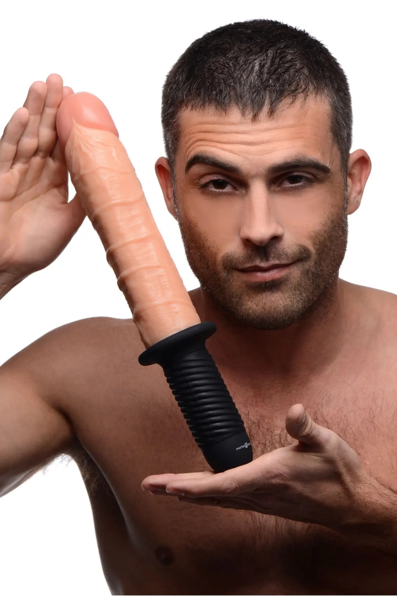 A man holding a Master Series Onslaught XL dildo with a realistic skin-toned textured shaft and black ribbed base.