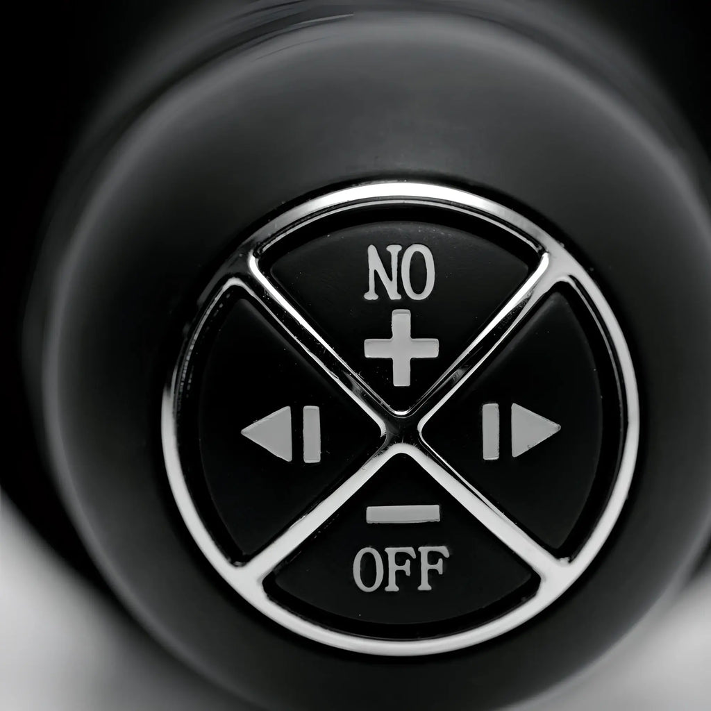 Close-up of the black circular control panel on a Master Series Onslaught thruster with white function icons.