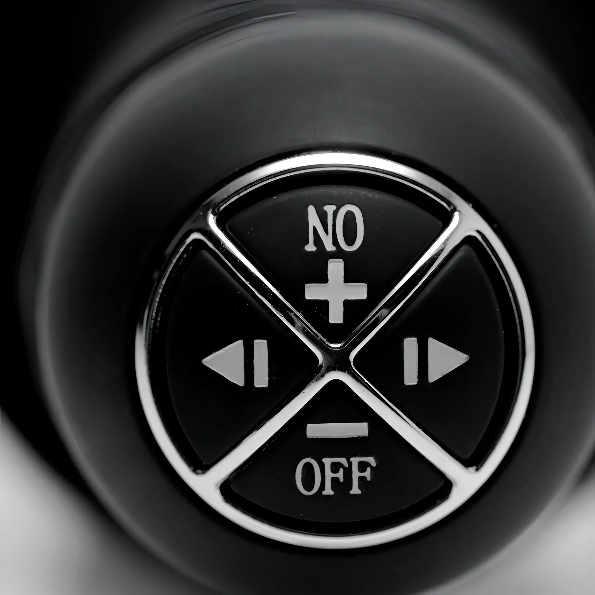 Close-up of the black circular control panel on a Master Series Onslaught thruster with white function icons.