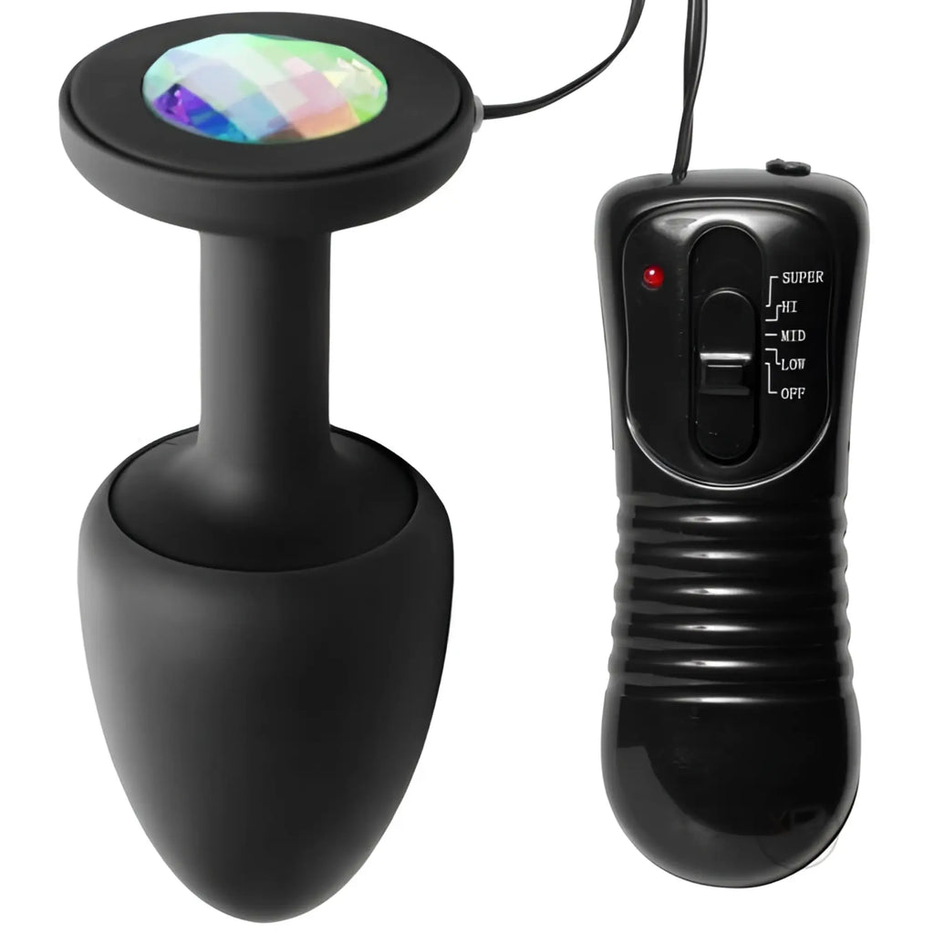 Master Series The Paragon Gem vibrating black silicone butt plug with a multicolored crystal top and wired remote.