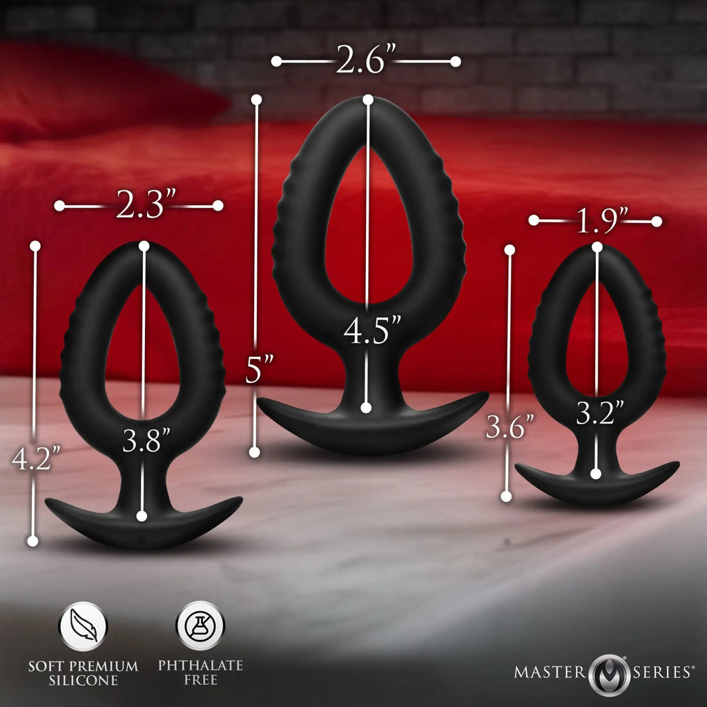 Master Series Pop Plugs: Three black hollow silicone anal trainers of varying sizes shown with measurement overlays.