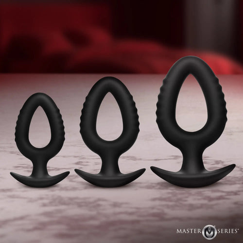 Master Series Pop Plugs: 3-piece set of black, hollow silicone anal trainers with teardrop shapes and flared bases.
