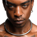 Close-up of a man wearing a smooth, silver-toned Master Series Possession Stainless Steel Locking Collar.
