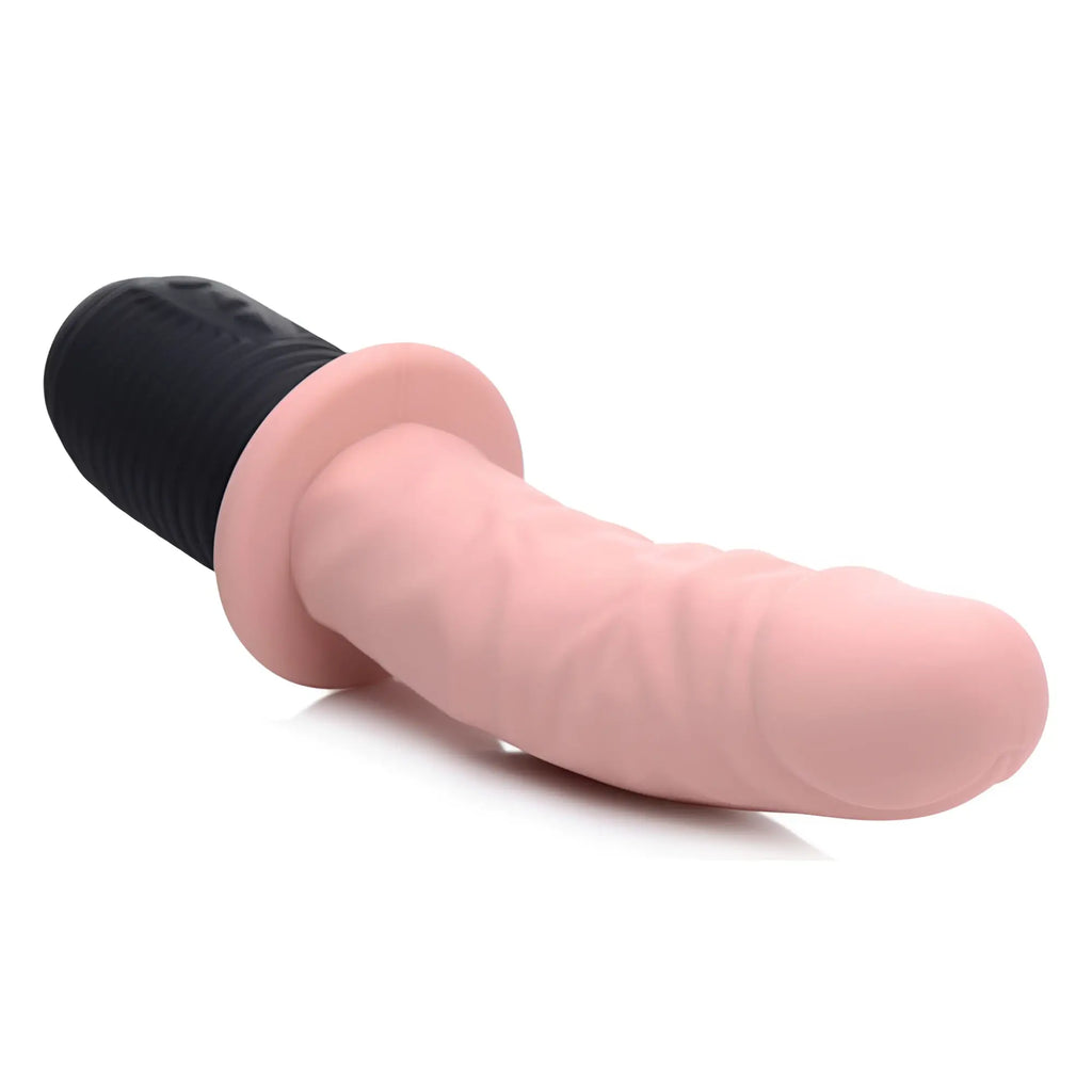 Master Series Power Pounder: A pink, realistic-textured silicone dildo with a black ribbed base, set on a white background.