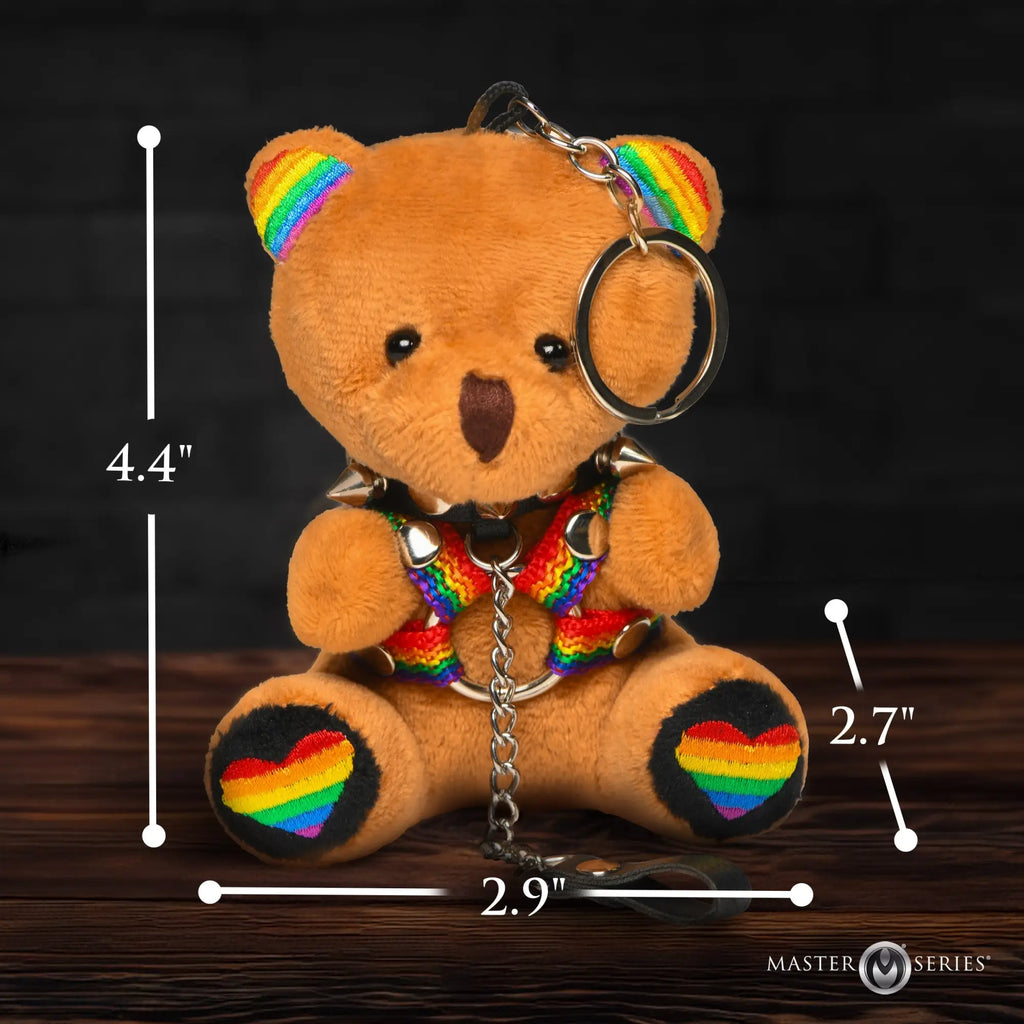 Master Series Pride Bear: a brown plush bear wearing a rainbow harness and spiked collar, with rainbow heart paw pads.