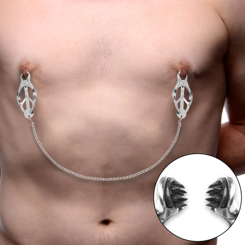 Master Series Primal Spiked Clover Nipple Clamps with chain on chest, showing detail of internal metal spikes.