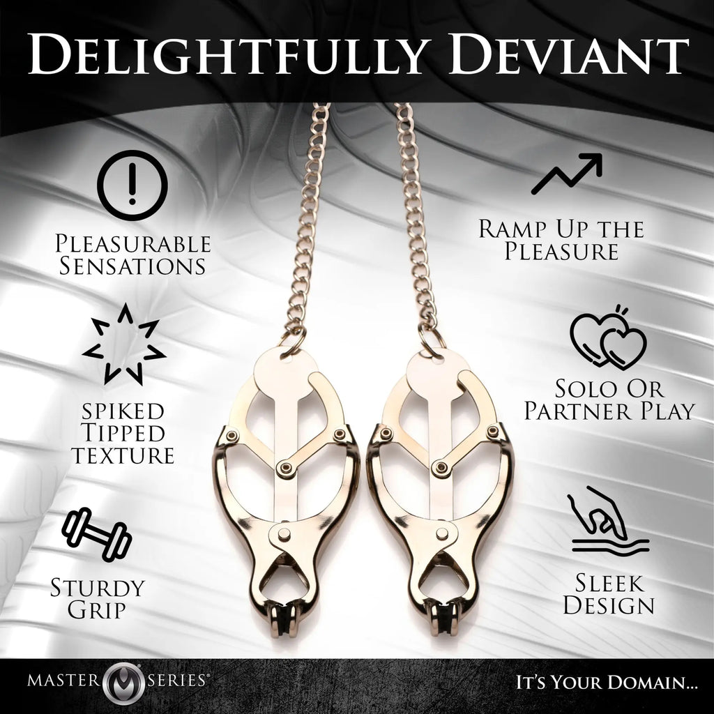 Master Series Primal Spiked Clover Nipple Clamps: two metallic, clover-shaped nipple clamps with chains and spike tips.