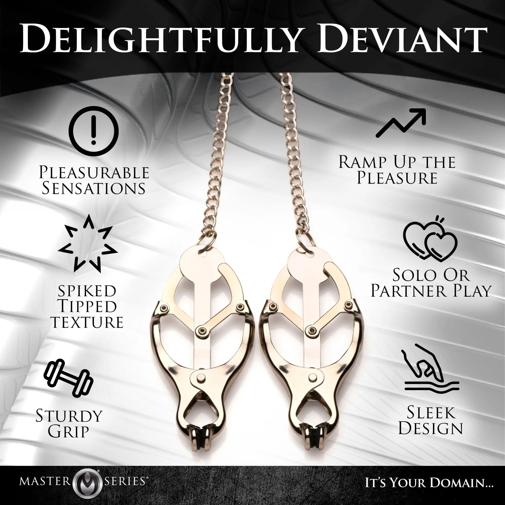 Master Series Primal Spiked Clover Nipple Clamps: two metallic, clover-shaped nipple clamps with chains and spike tips.