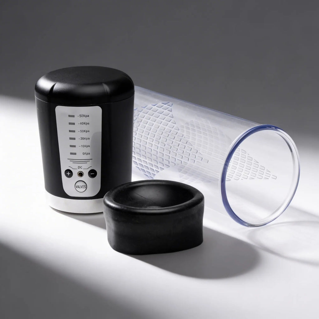Master Series Pumping Master: black electric suction unit with pressure settings, a clear tube, and a black silicone ring.
