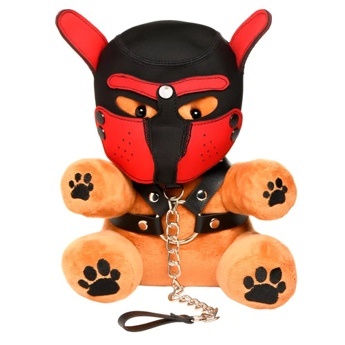 Master Series Pup Bear wearing a red and black hood and muzzle with a matching black harness and metal leash.