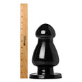 Master Series The Ram and Cram, a glossy black, flared-base anal plug shown next to a Westcott wooden ruler.