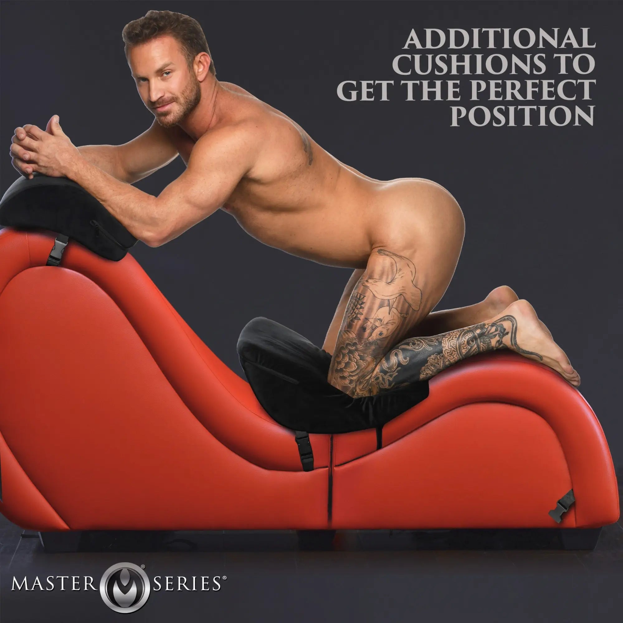 Master Series red detachable chaise with black love pillows, shown with a man in a kneeling position.