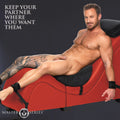 Master Series red detachable chaise lounge with black pillows and bondage straps, featuring a man lounging on it.