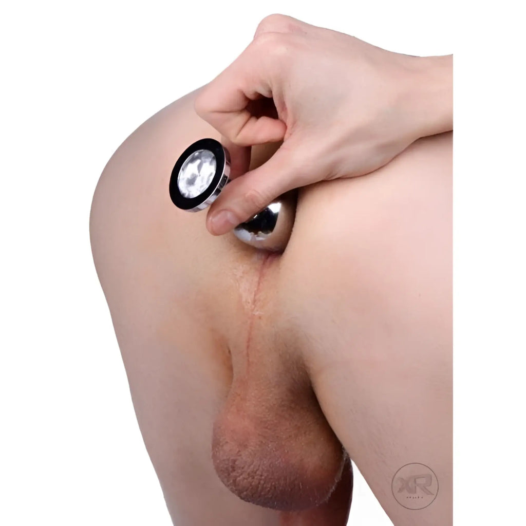 Master Series Rosebud anal jewelry featuring a polished silver-tone plug with a decorative black and clear jeweled base.