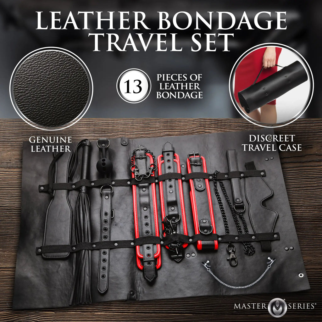 Master Series Scarlet Seduction: 13-piece black and red leather bondage travel set displayed on a wooden surface.