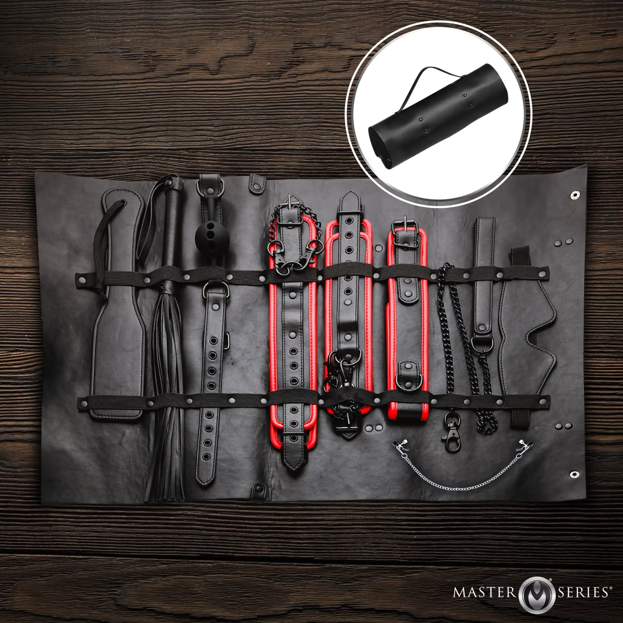 Master Series Scarlet Seduction travel set: black and red leather bondage gear organized in a roll-up storage case.