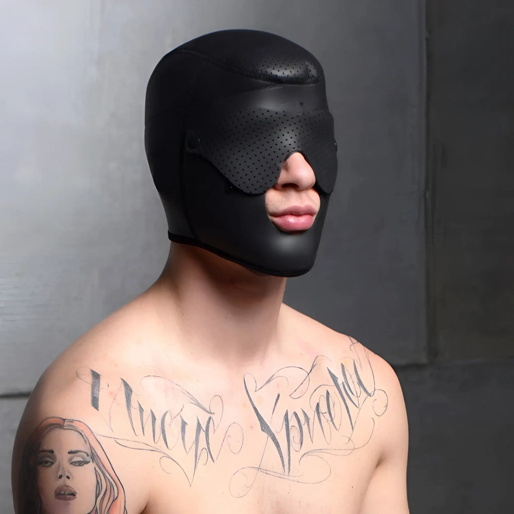 Master Series Scorpion hood in black, featuring a perforated removable blindfold and face mask on a tattooed man.