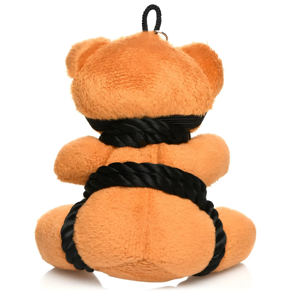 Master Series ShiBeari Keychain: A tan plush teddy bear tied with decorative black rope, featuring a top loop.
