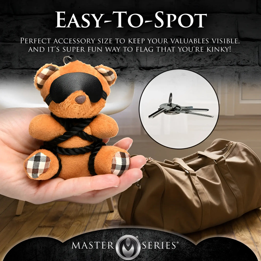Master Series ShiBeari Teddy Bear keychain, featuring a tan plush bear with a blindfold and rope harness.